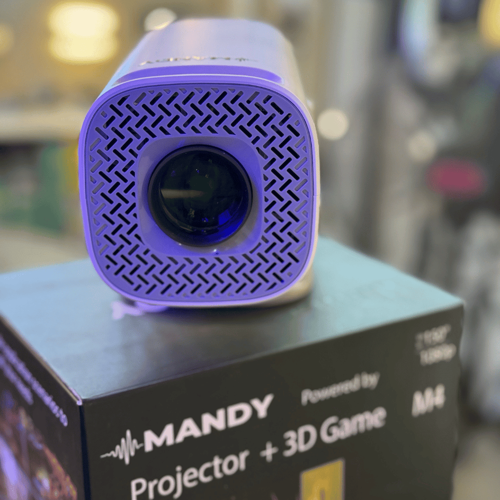 Purple projector on a box with 'MANDY' branding in an indoor setting