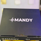 Box with 'MANDY' branding on a blurred background