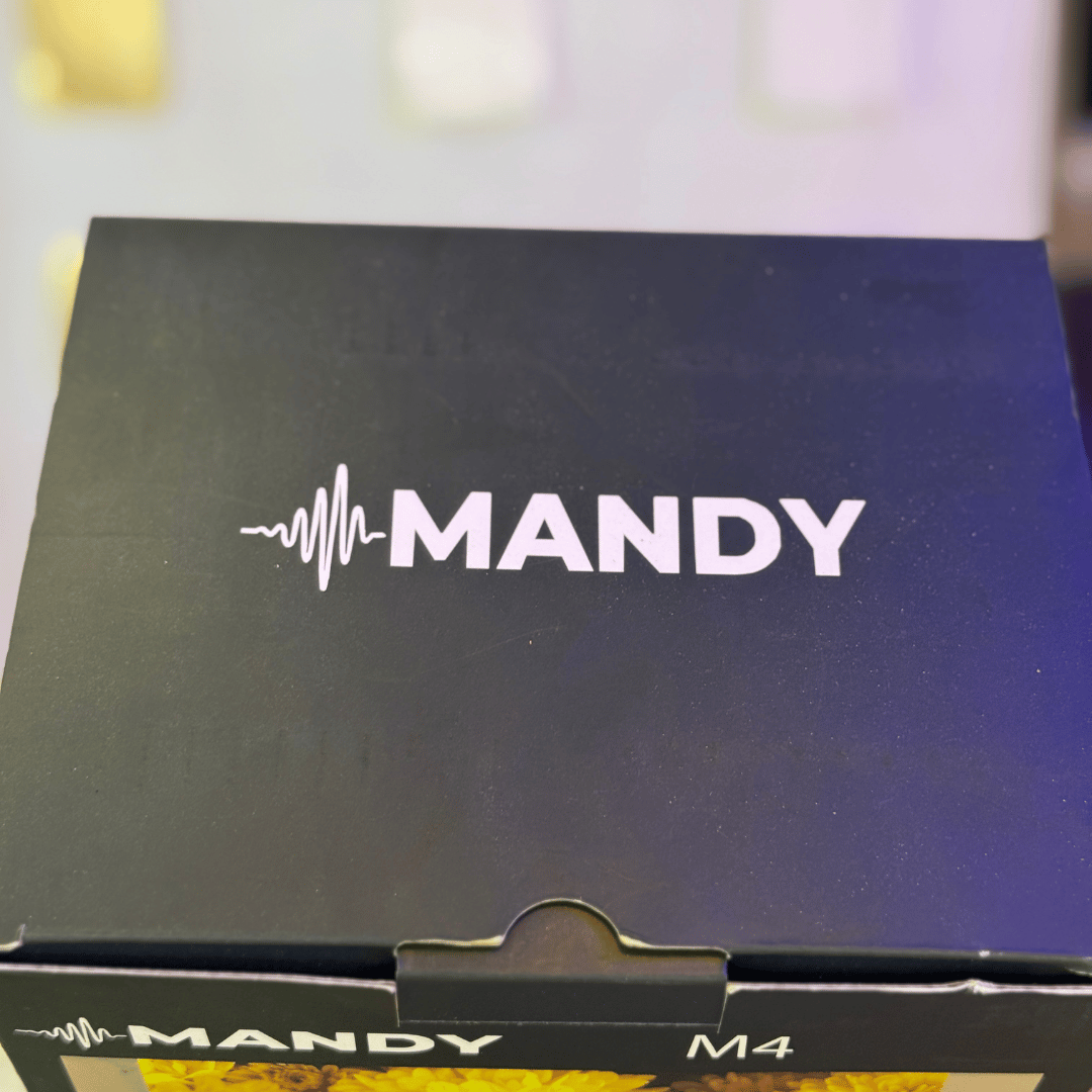 Box with 'MANDY' branding on a blurred background