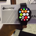 Mandy Android Smartwatch M12 with colorful app icons held in front of a MANDY branded box.