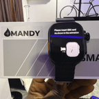 Mandy Android Smartwatch M12 with a screen displaying instructions held by a hand, with 'MANDY' branding in the background.